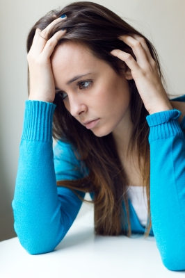 Sad Woman dealing with difficulty in forgiving someone